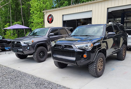 Featuring Toyota SUVs parked outside the Charleston repair shop